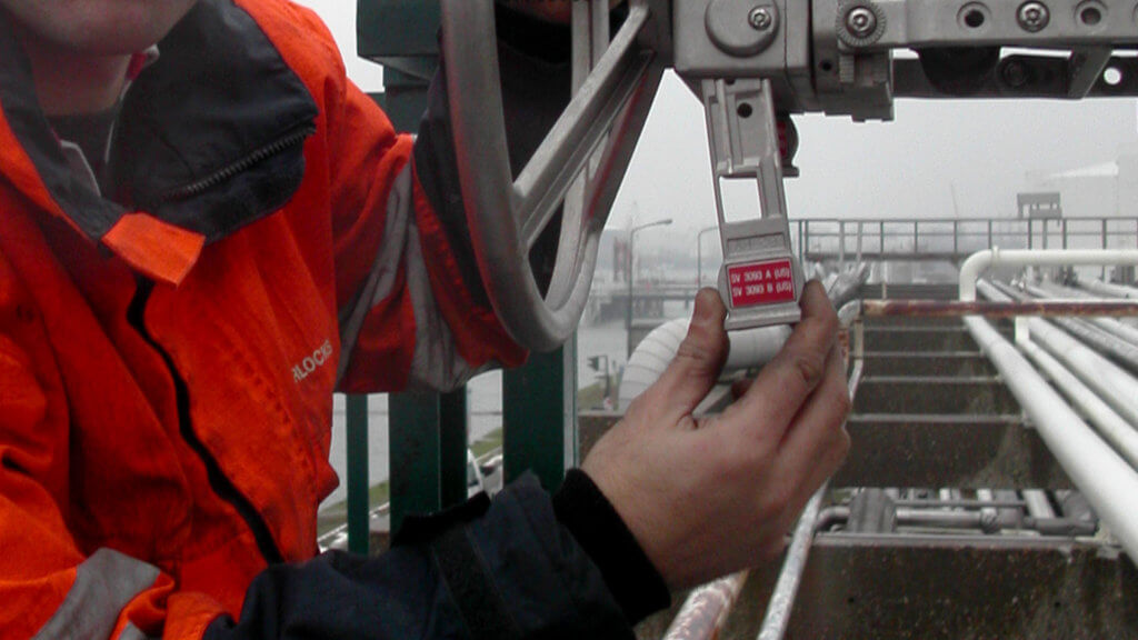 Operator inserts key in a valve interlock