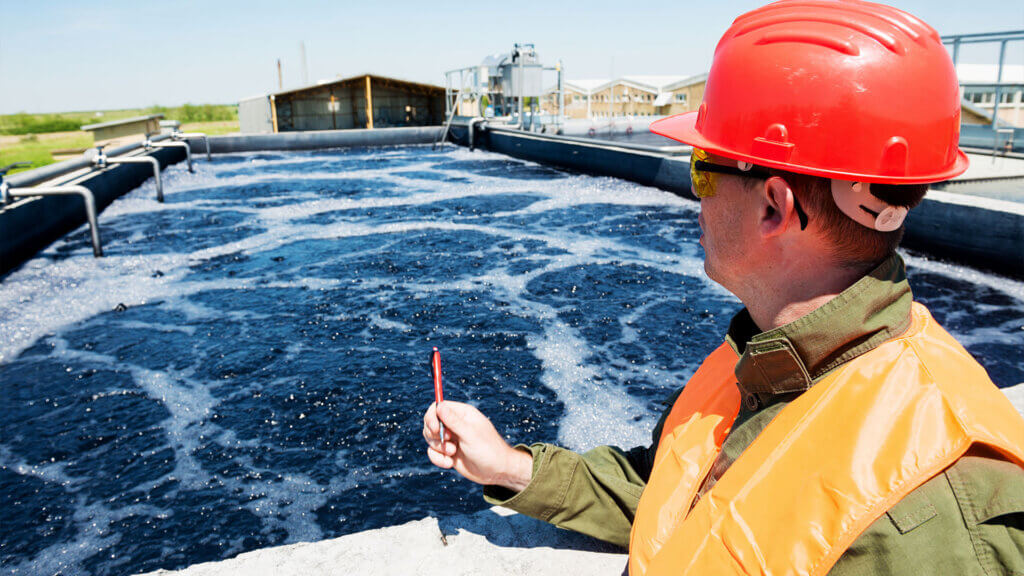 Engineer at sludge tank of waste water treatment plant